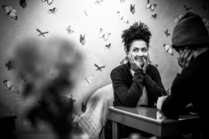 woman-and-man-sitting-at-table-surrounded-by-butterflies