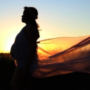 silhouette-of-pregnant-woman-with-sun-behind-her