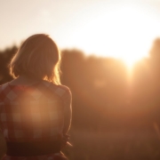 back-of-woman-looking-at-sunrise