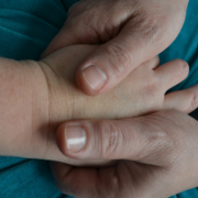woman-holding-hand-of-other-woman-close-up