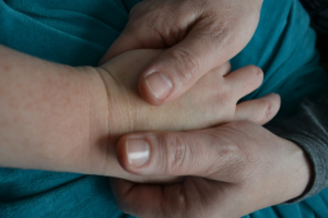 woman-holding-hand-of-other-woman-close-up