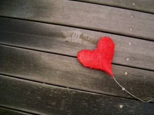 red-heart-on-wooden-floor