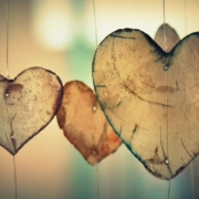 three-wooden-hearts-hanging-on wire