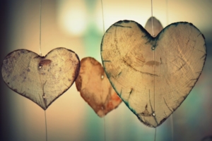 three-wooden-hearts-hanging-on wire