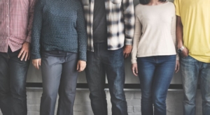 line-of-people-standing-against-a-wall