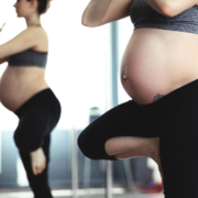 pregnant-woman-doing-yoga-tree-pose-with-mirror-reflection