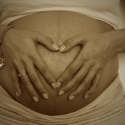pregnant-belly-with-hands-in-love-heart-in-the-middle