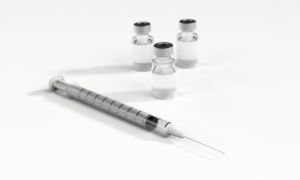 syringe-and-three-bottles-of-vaccine