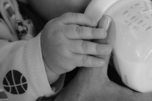 close-up-of-baby-feeding-from-bottle